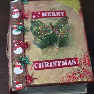 Whimsical Christmas-Themed Book-Shaped Trinket Box with Sparkly Butterfly Handle and Snowmen