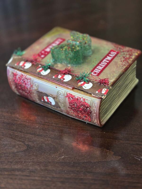 Whimsical Christmas-Themed Book-Shaped Trinket Box with Sparkly Butterfly Handle and Snowmen - Image 2