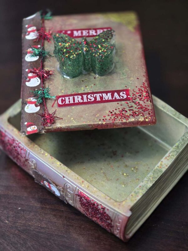 Whimsical Christmas-Themed Book-Shaped Trinket Box with Sparkly Butterfly Handle and Snowmen - Image 4